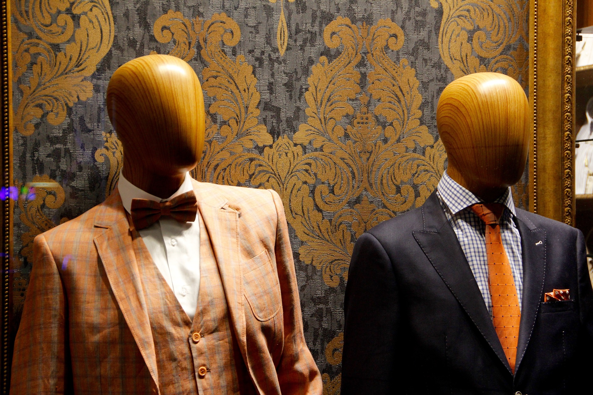 Do Men Hate Shopping. Maynineteen blog post. Image of two traditional wooden male mannequins dressed in elegant and well-tailored suits