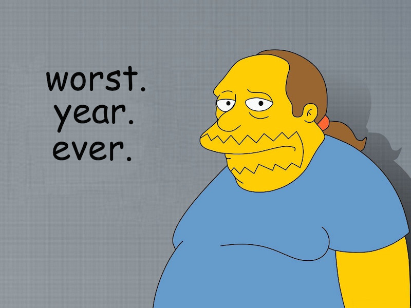 Cartoon character from TV show, The Simpsons looks towards camera with a sad expression. The caption reads, Worst. Year. Ever.